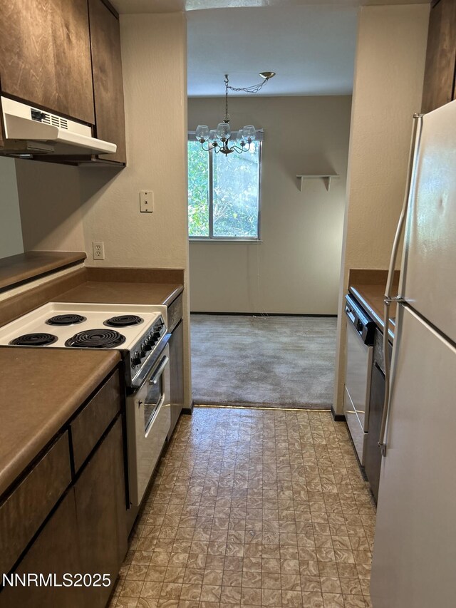 1000 Beck St Unit 361, Reno, NV 89509 - kitchen featuring freestanding refrigerator, electric stove, under cabinet range hood, a chandelier, and dishwashing machine