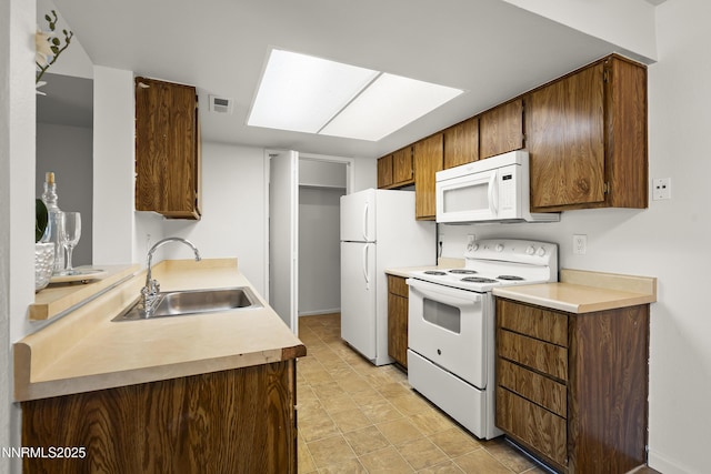 555 E Patriot Blvd Unit 218, Reno, NV 89511 - kitchen featuring white appliances and light countertops