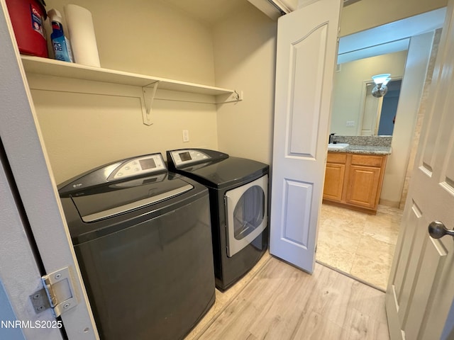 200 W 2nd St Unit 1107, Reno, NV 89501 - laundry room featuring washing machine and dryer and light wood-type flooring