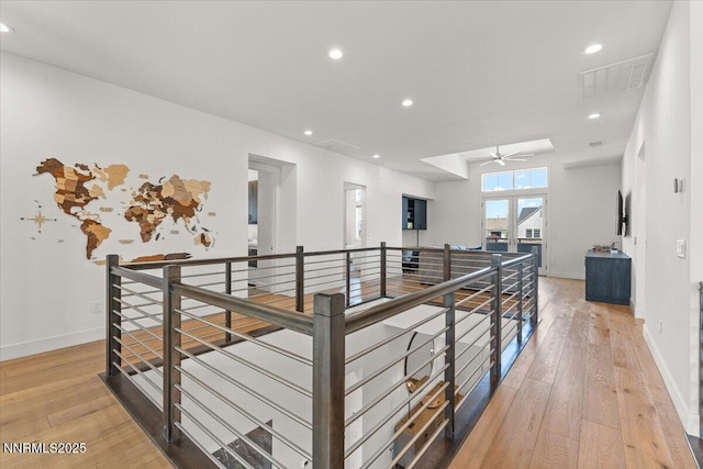 206 Criollo Ct, Reno, NV 89511 - hallway with an upstairs landing, light wood-style flooring, and recessed lighting