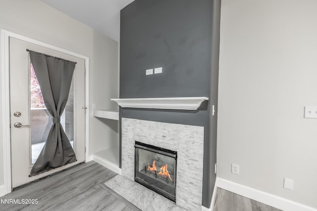 900 S Meadows Pkwy Apt 322, Reno, NV 89521 - unfurnished living room with a fireplace and wood finished floors