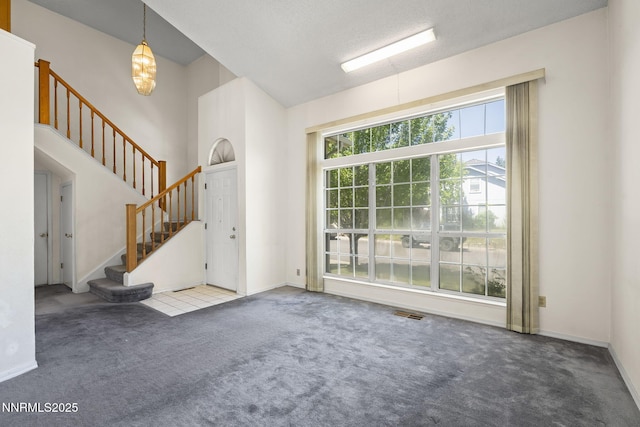940 Skyway Dr, Reno, NV 89523 - foyer featuring carpet floors and stairs