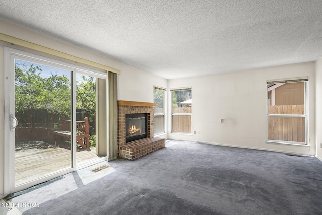 940 Skyway Dr, Reno, NV 89523 - unfurnished living room with carpet floors, a brick fireplace, and a textured ceiling