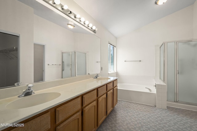 940 Skyway Dr, Reno, NV 89523 - full bath with a shower stall, a garden tub, double vanity, a walk in closet, and vaulted ceiling