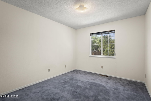 940 Skyway Dr, Reno, NV 89523 - unfurnished room with dark colored carpet and a textured ceiling