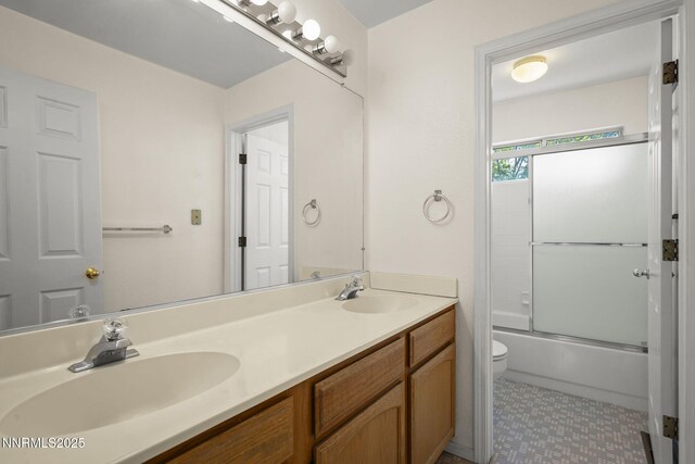 940 Skyway Dr, Reno, NV 89523 - bathroom featuring double vanity and enclosed tub / shower combo