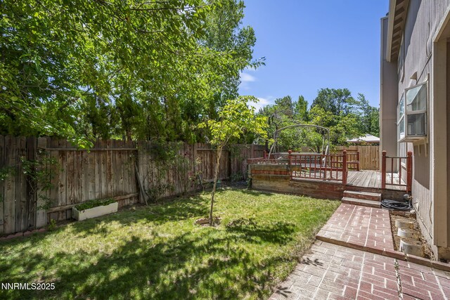 940 Skyway Dr, Reno, NV 89523 - fenced backyard featuring a deck and a patio