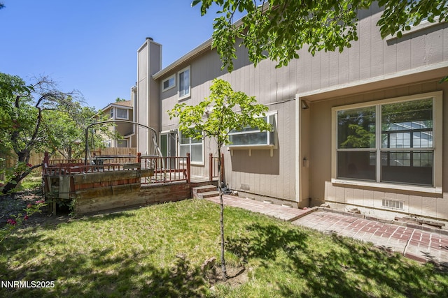 940 Skyway Dr, Reno, NV 89523 - back of property with a yard and a chimney