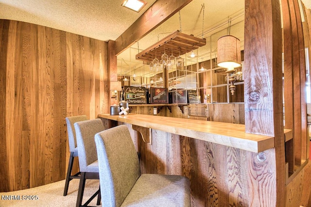 128 Holly Ln Unit B, Stateline, NV 89449 - indoor dry bar featuring wood walls and carpet floors