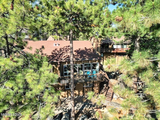 128 Holly Ln Unit B, Stateline, NV 89449 - rear view of property featuring a deck and stairway