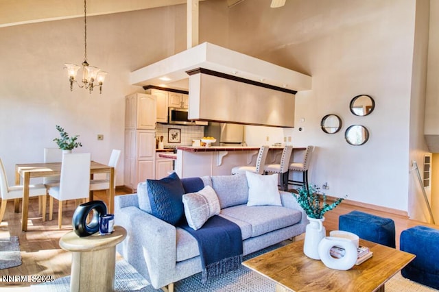 128 Holly Ln Unit B, Stateline, NV 89449 - living room with a towering ceiling, light wood-style floors, and a chandelier