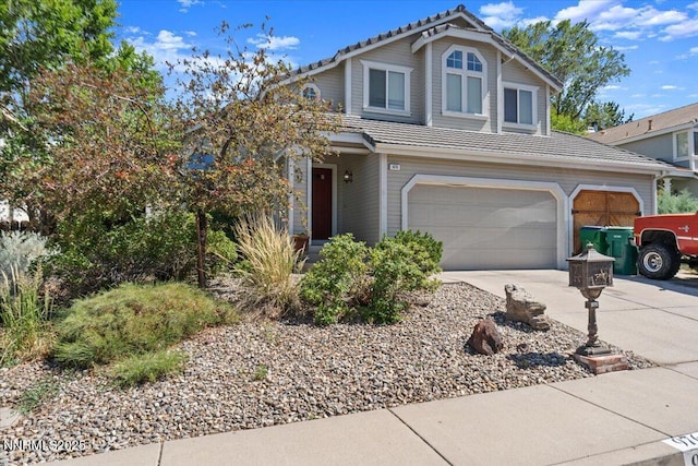 976 Leah Cir, Reno, NV 89511 - traditional home with concrete driveway, a garage, and a tiled roof