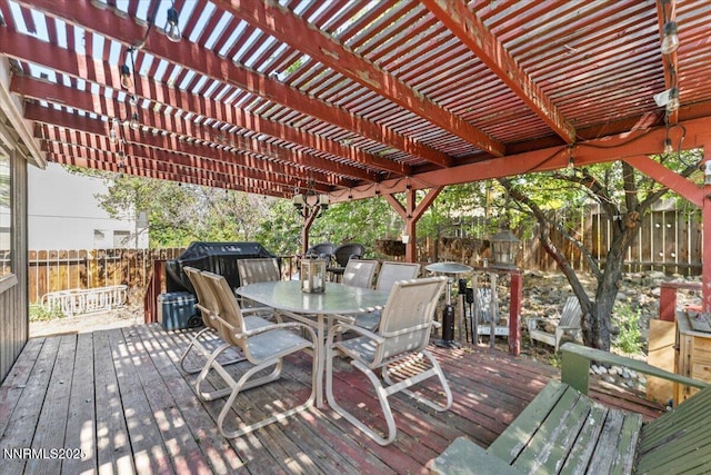 976 Leah Cir, Reno, NV 89511 - wooden deck with outdoor dining space, a fenced backyard, and area for grilling