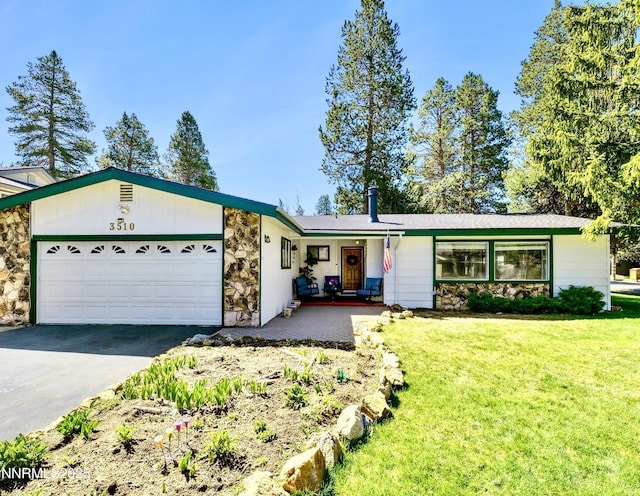 3510 Rancho Cir S, Lake Tahoe, CA 96150 - single story home with stone siding, asphalt driveway, and a front lawn