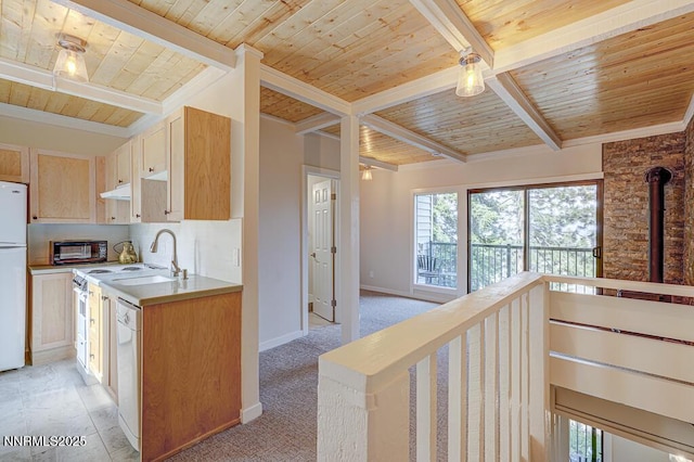 331 Tramway Dr Unit 17, Stateline, NV 89449 - kitchen with a wood ceiling with exposed beams, white appliances, under cabinet range hood, light countertops, and light carpet