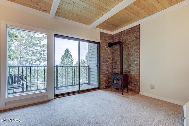 331 Tramway Dr Unit 17, Stateline, NV 89449 - living area featuring a wooden ceiling with exposed beams, healthy amount of natural light, carpet flooring, a wood stove, and crown molding