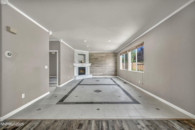 2182 Talladega Ct, Sparks, NV 89436 - unfurnished living room with tile patterned flooring, crown molding, inlaid floor details, a fireplace, and recessed lighting