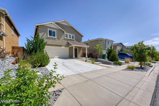 10965 Bloomsburg Dr, Reno, NV 89506 - view of front facade with stucco siding, concrete driveway, and a garage