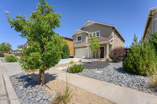 10965 Bloomsburg Dr, Reno, NV 89506 - view of front of house with driveway, an attached garage, and stucco siding