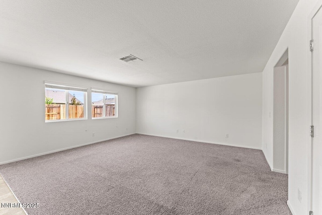 10965 Bloomsburg Dr, Reno, NV 89506 - spare room with carpet and a textured ceiling