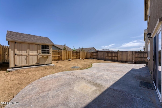 10965 Bloomsburg Dr, Reno, NV 89506 - fenced backyard featuring a patio and a storage unit
