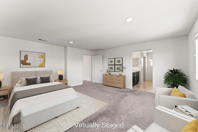 10965 Bloomsburg Dr, Reno, NV 89506 - bedroom featuring light colored carpet, recessed lighting, and ensuite bath