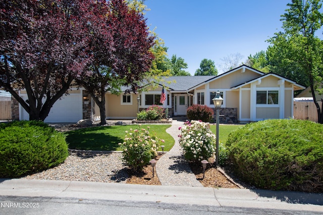 185 Marmot Dr, Reno, NV 89523 - single story home with an attached garage and stone siding