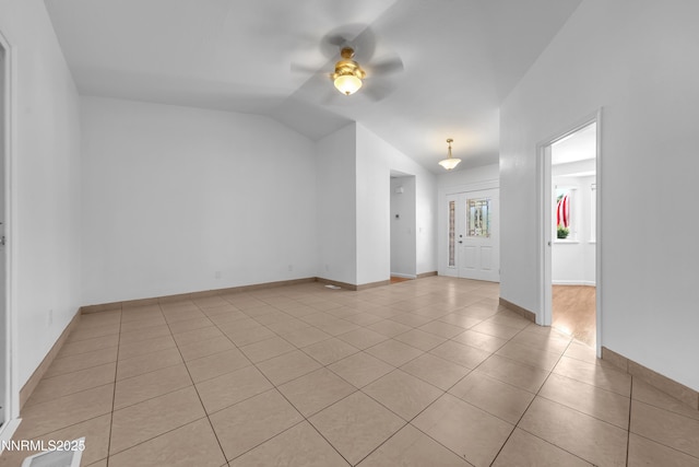 185 Marmot Dr, Reno, NV 89523 - spare room featuring ceiling fan, light tile patterned floors, and vaulted ceiling