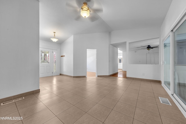 185 Marmot Dr, Reno, NV 89523 - unfurnished room with a ceiling fan, vaulted ceiling, and tile patterned flooring