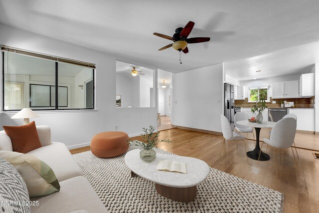 185 Marmot Dr, Reno, NV 89523 - living room featuring ceiling fan and light wood finished floors