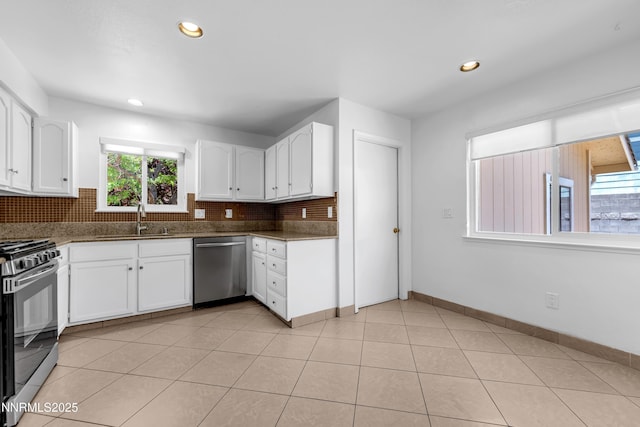 185 Marmot Dr, Reno, NV 89523 - kitchen with appliances with stainless steel finishes, decorative backsplash, white cabinets, and recessed lighting