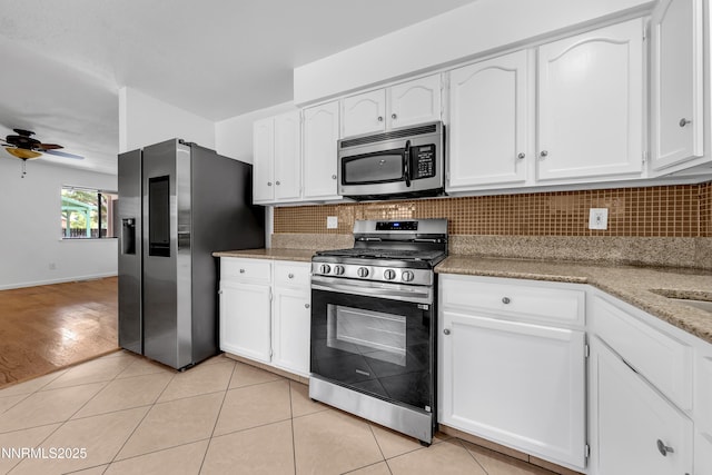 185 Marmot Dr, Reno, NV 89523 - kitchen with stainless steel appliances, a ceiling fan, tasteful backsplash, and white cabinets
