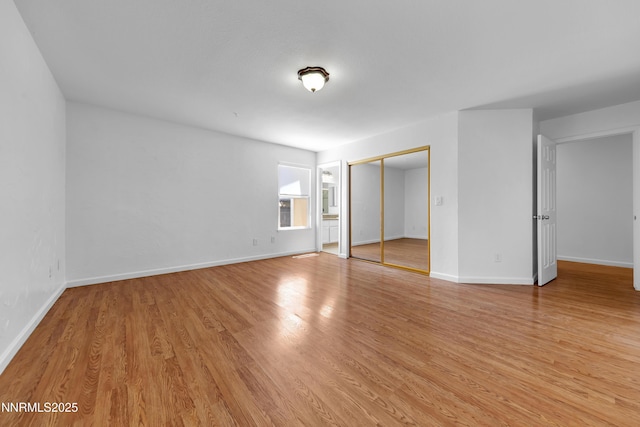 185 Marmot Dr, Reno, NV 89523 - unfurnished bedroom featuring light wood finished floors and a closet