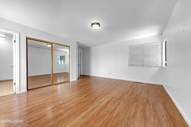 185 Marmot Dr, Reno, NV 89523 - unfurnished bedroom with light wood-style floors and a closet