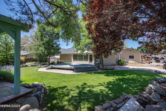 185 Marmot Dr, Reno, NV 89523 - rear view of house featuring a wooden deck and a sunroom