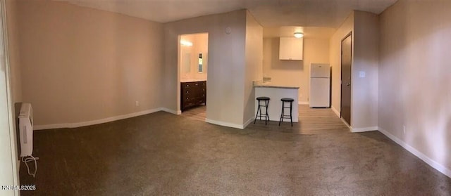 2450 Lymbery St Apt 107, Reno, NV 89509 - spare room with baseboards and carpet