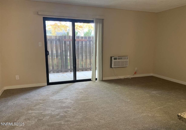 2450 Lymbery St Apt 107, Reno, NV 89509 - carpeted empty room featuring baseboards and a wall unit AC