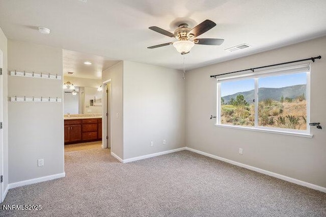 1825 Star Bright Way, Reno, NV 89523 - unfurnished bedroom with light colored carpet, ensuite bathroom, and ceiling fan