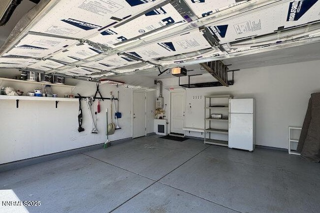 1825 Star Bright Way, Reno, NV 89523 - garage with freestanding refrigerator and a garage door opener