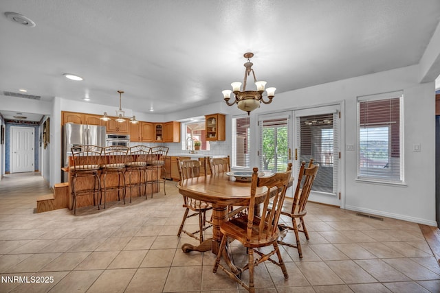 3400 Cartwright Rd, Reno, NV 89521 - dining area with a chandelier, light tile patterned floors, and recessed lighting