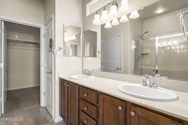 1245 W Del Webb Pkwy, Reno, NV 89523 - bathroom with a shower with shower door, double vanity, and a spacious closet