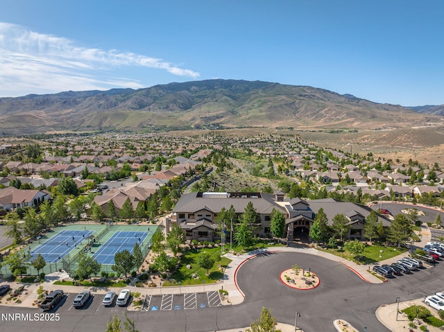 1245 W Del Webb Pkwy, Reno, NV 89523 - aerial view of property and surrounding area with nearby suburban area and a mountainous background
