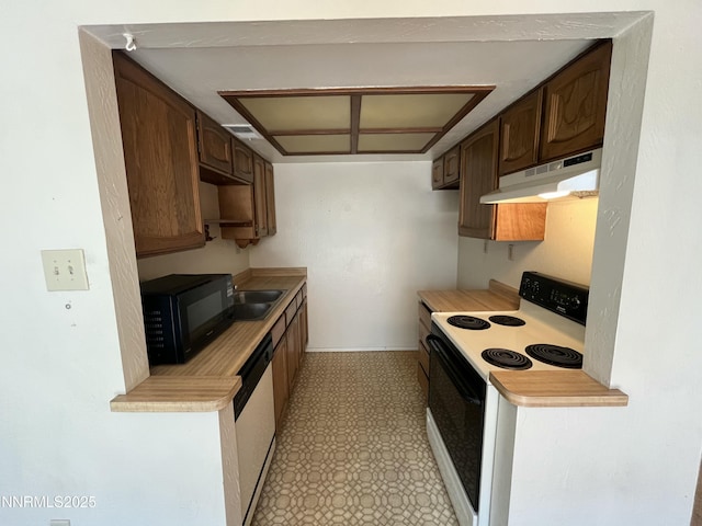972 Flatcar Ln, Sparks, NV 89431 - kitchen featuring white appliances, under cabinet range hood, light flooring, and light countertops