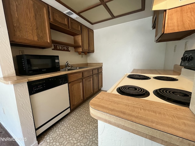 972 Flatcar Ln, Sparks, NV 89431 - kitchen with white dishwasher, black microwave, light countertops, electric range oven, and ventilation hood