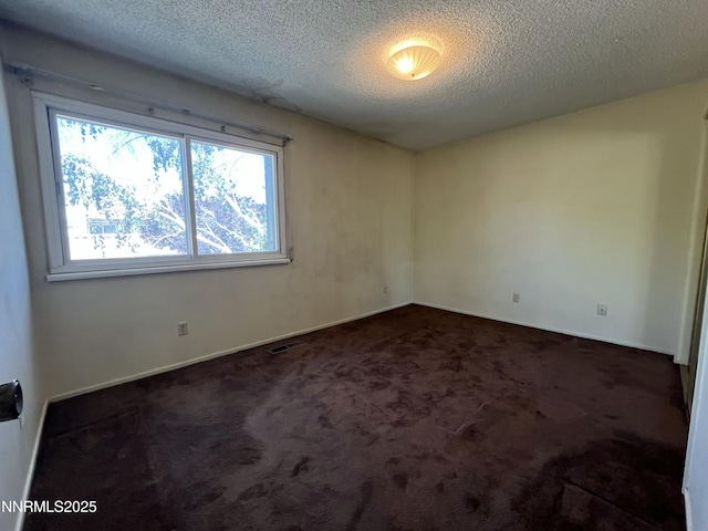 972 Flatcar Ln, Sparks, NV 89431 - unfurnished room with a textured ceiling and carpet flooring
