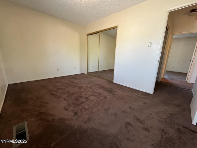 972 Flatcar Ln, Sparks, NV 89431 - unfurnished bedroom featuring carpet floors, a closet, and a textured ceiling