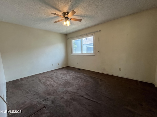 972 Flatcar Ln, Sparks, NV 89431 - empty room with a ceiling fan, dark colored carpet, and a textured ceiling