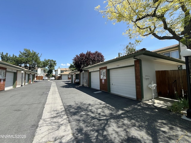 972 Flatcar Ln, Sparks, NV 89431 - view of asphalt road featuring community garages and a residential view