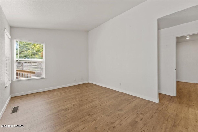 7560 Lighthouse Ln, Reno, NV 89511 - spare room with wood finished floors and baseboards