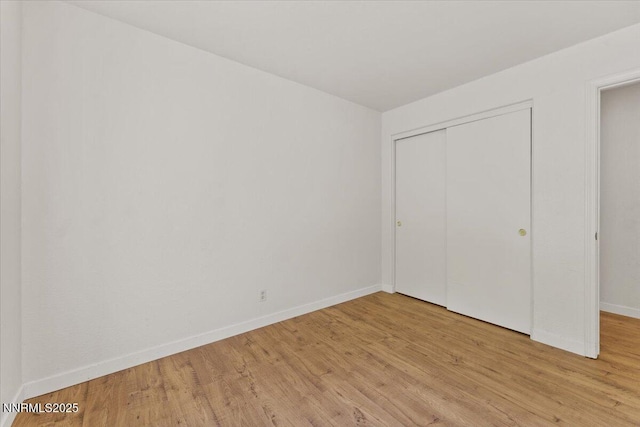 7560 Lighthouse Ln, Reno, NV 89511 - unfurnished bedroom with light wood-type flooring and a closet